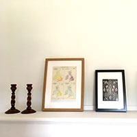 Old house pictures on mantelpiece